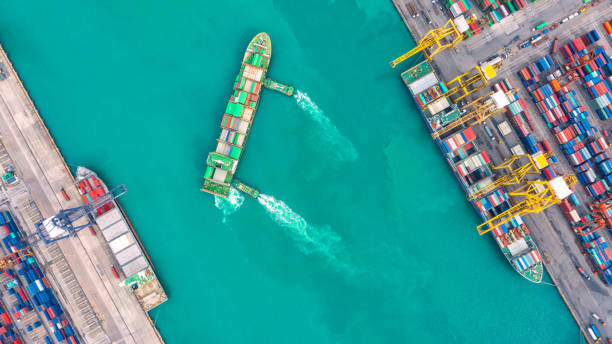 istock Container ship in export and import business logistics and transportation. Cargo and container box shipping to harbor by crane. Water transport International. Aerial view and top view. 1093980798
