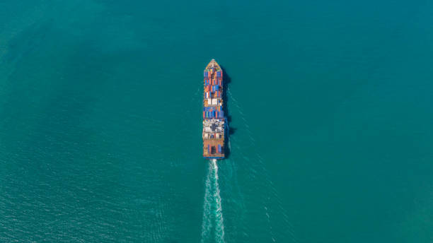 istock Container ship in export and import business logistics and transportation. Cargo and container box shipping to harbor by crane. Water transport International. Aerial view and top view. 1093980810