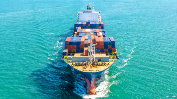 istock Container ship in export and import business logistics and transportation. Cargo and container box shipping to harbor by crane. Water transport International. Aerial view and top view. 1093980814