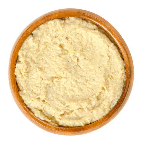 istock Hummus in wooden bowl over white 1093981216