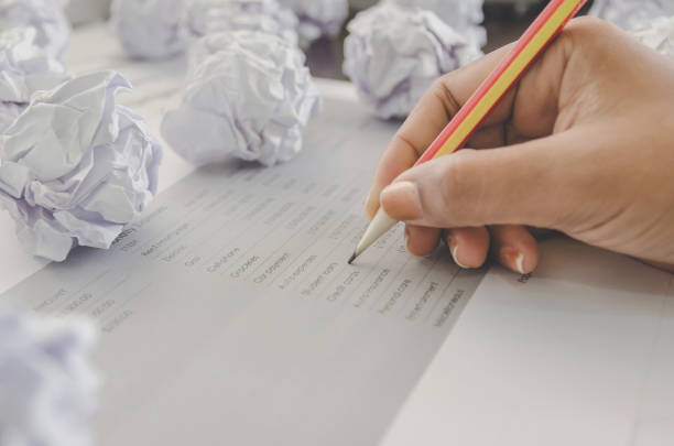 istock No idea and fail concept - Human hand holding crumpled paper and trash. 1093981480