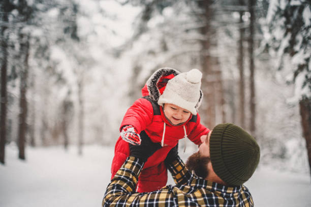istock Father and baby boy in snow 1093984150