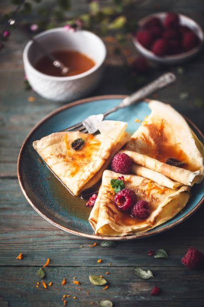 Pancake Suzette Citrus Sauce and Rum and Raspberries for Candlemas Crêpe Suzette Citrus Sauce and Rum and Raspberries for Candlemas candlemas stock pictures, royalty-free photos & images