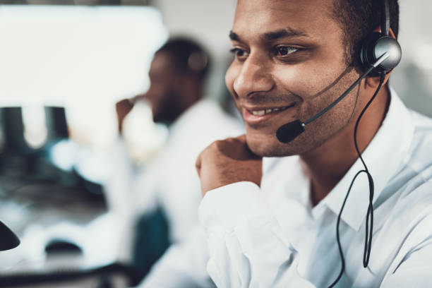 istock Close up of smiling dispatch man sitting in headset 1093988082