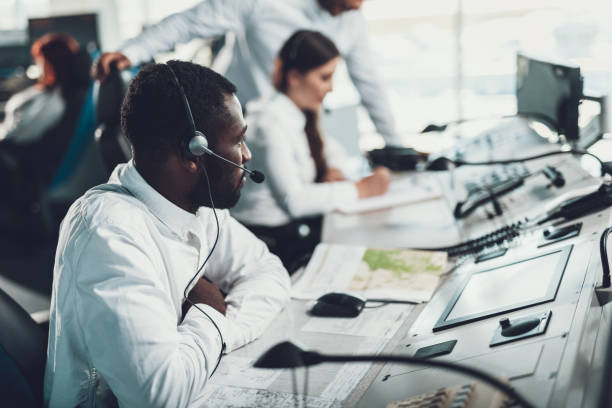 istock Young male dispatcher sitting on work table 1093988176