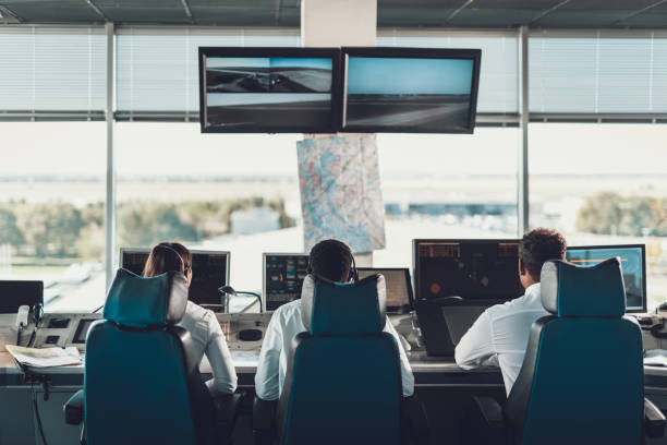 istock Group of air dispatchers working in navigation room 1093988190