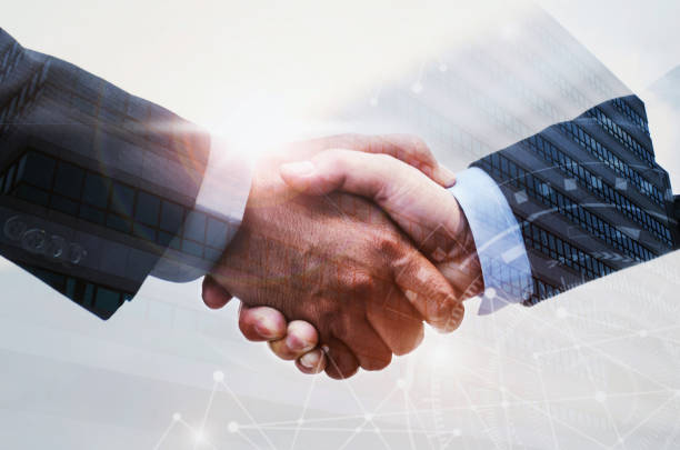 istock double exposure of business man handshake on modern office building background with network connection graphic diagram, partnership business,  teamwork global, technology and digital internet concept 1093988358