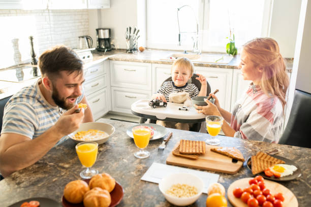 istock Happy Family at Kitchen Table in Morning 1093988454