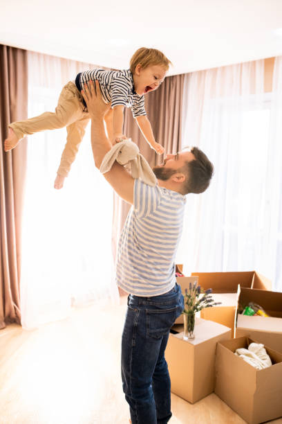 istock Father Playing with Son at Home 1093988478