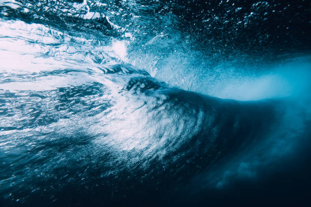 istock Underwater barrel wave. Perfect barrel wave breaking in ocean. 1093991446