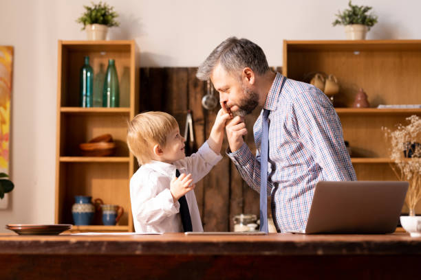 istock Funny father and son doing role-playing game 1093991588