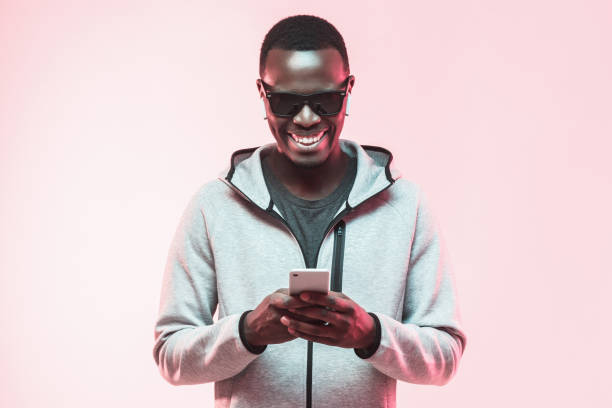 istock Excited african american guy using mobile phone 1093991984