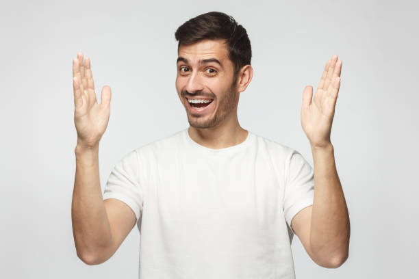 istock Young man showing big size gesture with hands, emphasizing great amount of something 1093992104