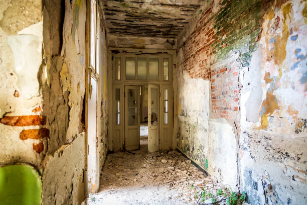 istock old neglected and destroyed interior rooms. a little noisy effect for bigger drama. 1093992624