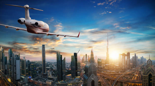 istock Private jet plane flying above Dubai city 1093995358