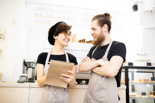 istock Positive coffee shop colleagues chatting 1093997138