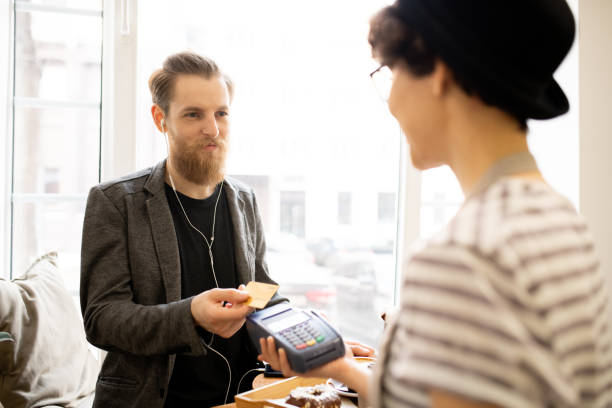 istock Satisfied man paying for bill in cafe 1093997672