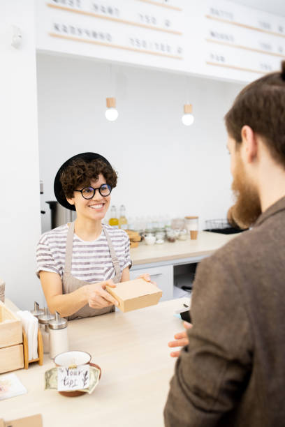 istock Man buying snack in coffee shop 1093997740