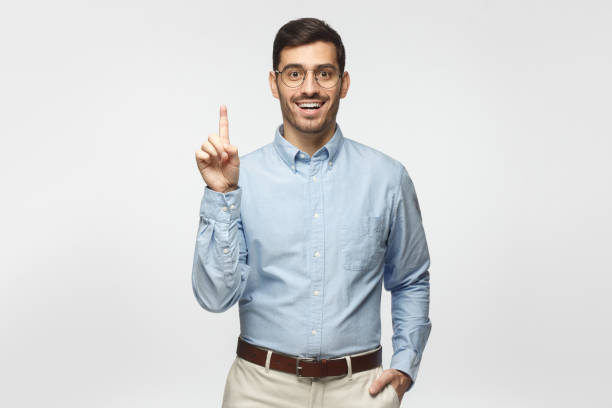 istock I have a great idea! Handsome businessman, pointing up with index finger. Eureka, solution sign concept 1093999846