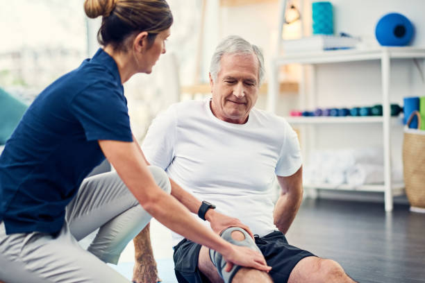 Let me know if this helps Cropped shot of an attractive young female physiotherapist working with a senior male patient orthopedics photos stock pictures, royalty-free photos & images
