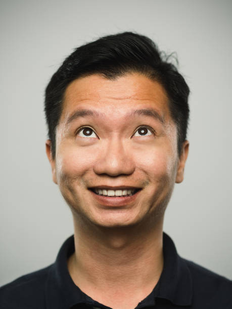 istock Real chinese man with happy expression looking up 1094001304