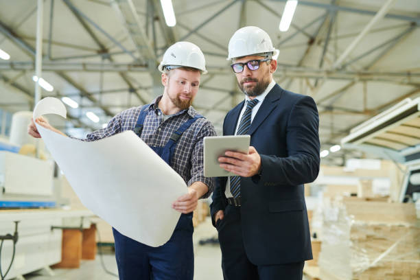 istock Handsome investor showing online data to engineer 1094011074