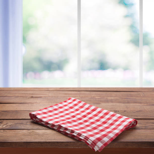 istock kitchen table with tablecloth near the window with a summer background 1094011234