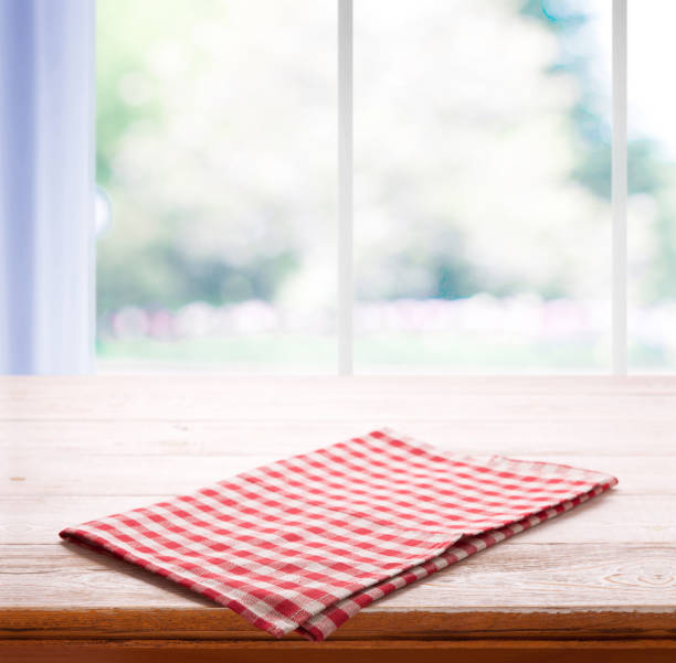 istock Napkin on the table and kitchen window blurred background 1094011240