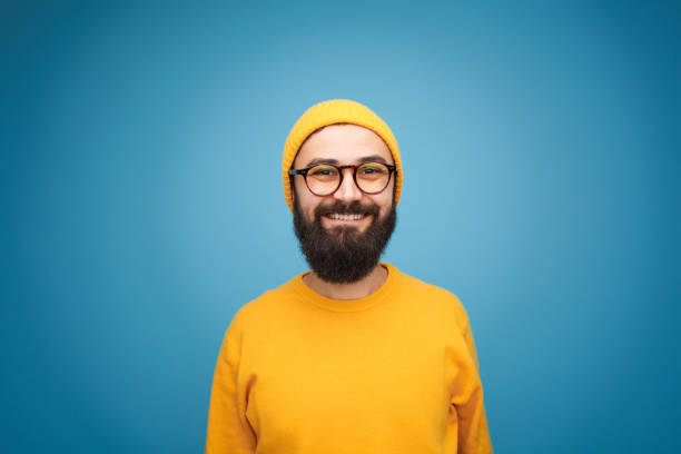 istock Smiling happy bearded hipster on blue 1094012842