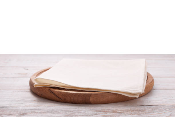 istock Pizza board, with napkin on wooden table isolated. Top view mockup 1094015064