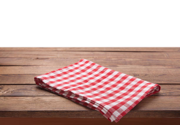 istock Kitchen towel on empty wooden table. Napkin close up top view mock up for design. Kitchen rustic background. 1094015078