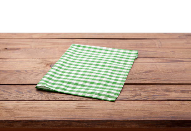 istock Kitchen towel on empty wooden table. Napkin close up top view mock up for design. Kitchen rustic background. 1094015080