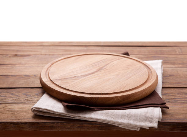 istock Pizza board, with napkin on wooden table isolated. Top view mockup 1094015096