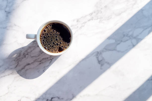 istock a cup of coffee on marble table 1094018608
