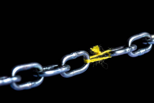 istock Close-Up Of Chain Against Black Background 1094019236