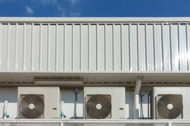 istock External air conditioning units outside a building with blue sky background 1094027194