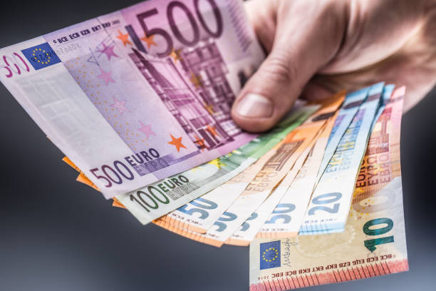 istock Male holding euro banknotes in his hands. 1094027758