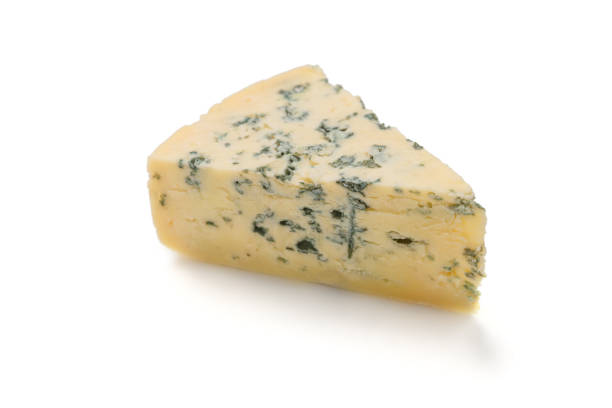 istock Wedge of soft blue cheese with mold isolated on white background. 1094030112