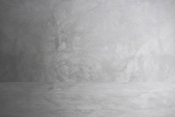 istock gray cement wall studio and blank floor background for present product 1094030270