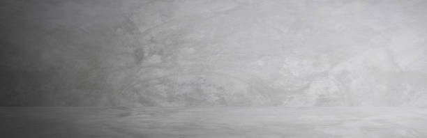 istock gray cement wall studio and blank floor background for present product 1094030304