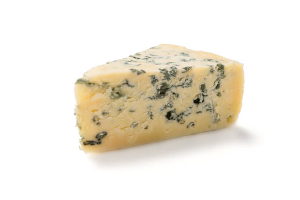 istock Wedge of soft blue cheese with mold isolated on white background. 1094030312