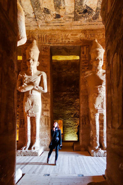 istock Abu Simbel - Traveller inside Temple in Egypt Between  statues 1094031602