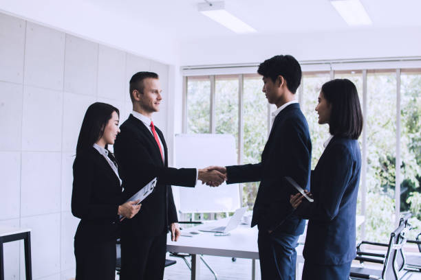 istock business people negotiate and shake hands after successful agreement 1094032134