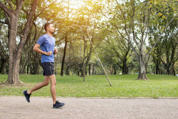 istock Runner man run in park, exercise and worm up concept 1094032394