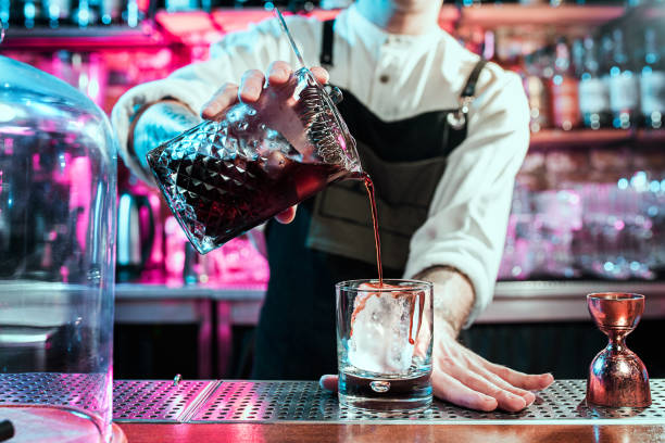istock Expert barman is making cocktail at night club. 1094035872