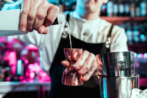 istock Expert barman is making cocktail at night club. 1094035874