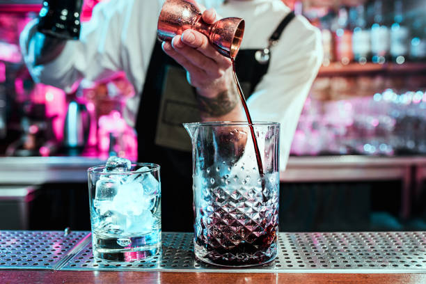 istock Expert barman is making cocktail at night club. 1094035918