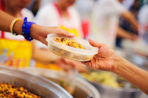 istock Help serving free food to the poor Needy 1094040400