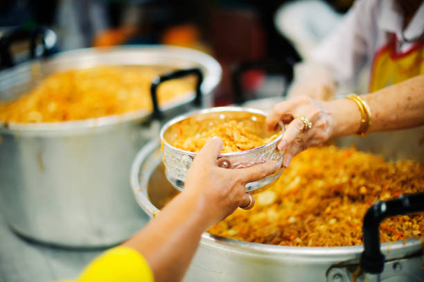 istock Help serving free food to the poor Needy 1094040416