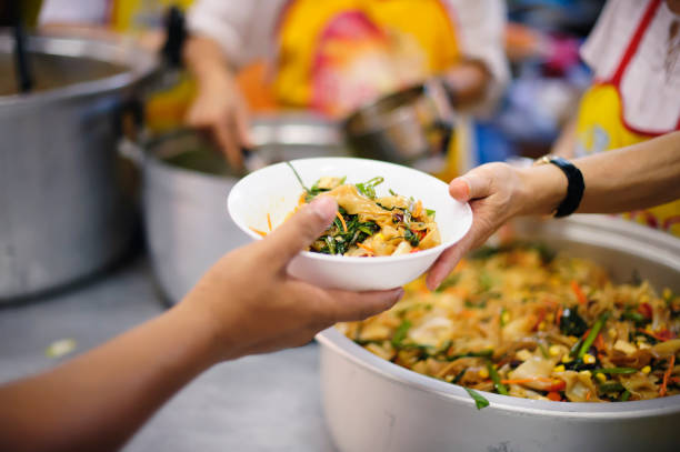 istock Donate food to the poor and the poor who suffer from starvation 1094040708